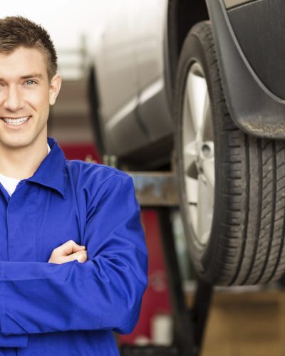 Happy Car Mechanic Holding Wrench